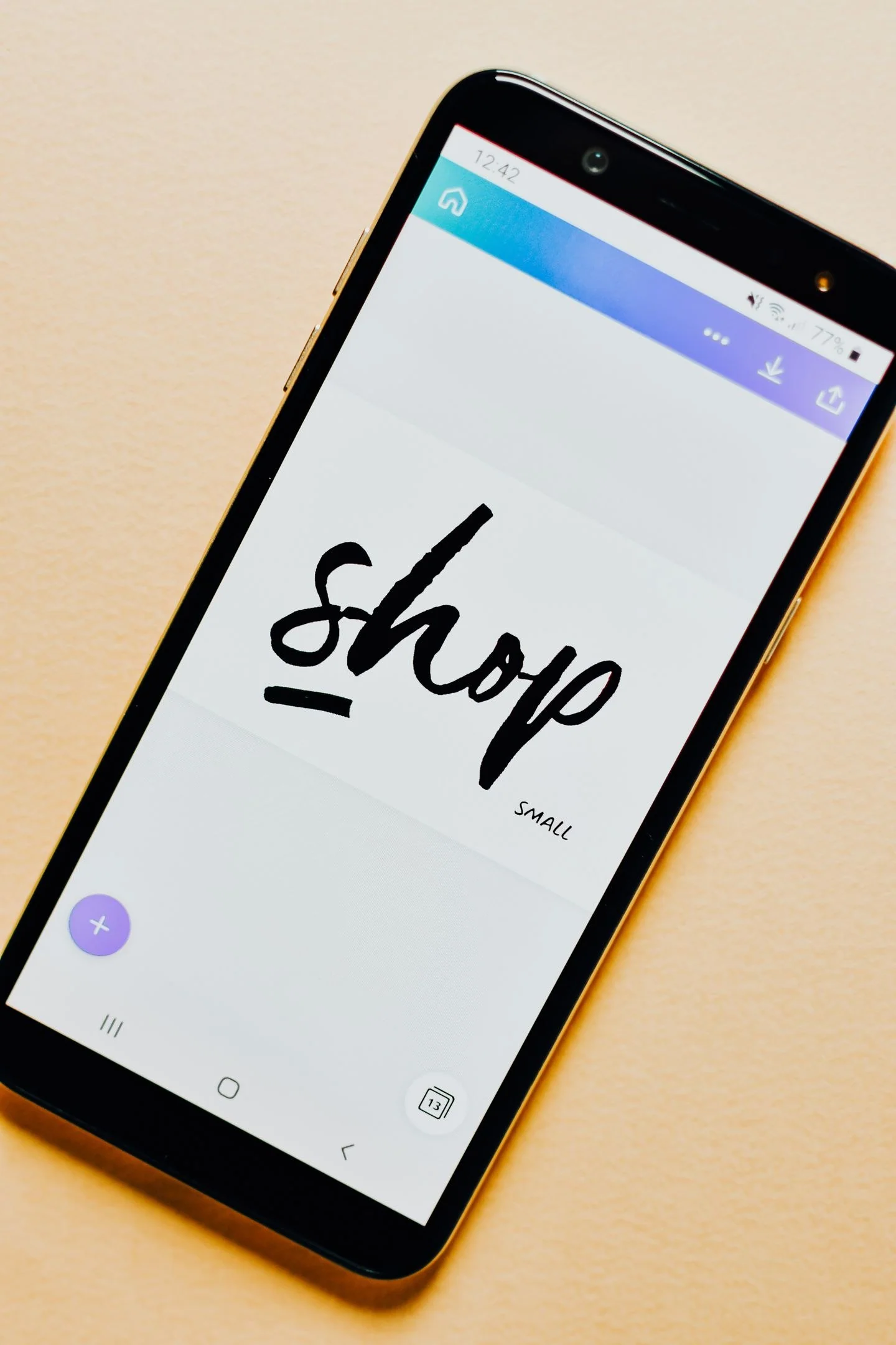 Close-up of a smartphone screen with a 'Shop' application interface on a light background.