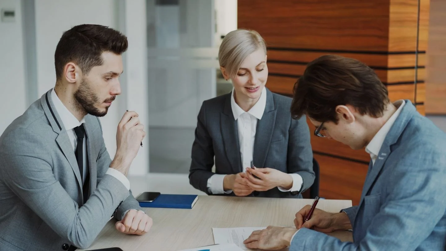 Professional team in business meeting, discussing strategy at office.