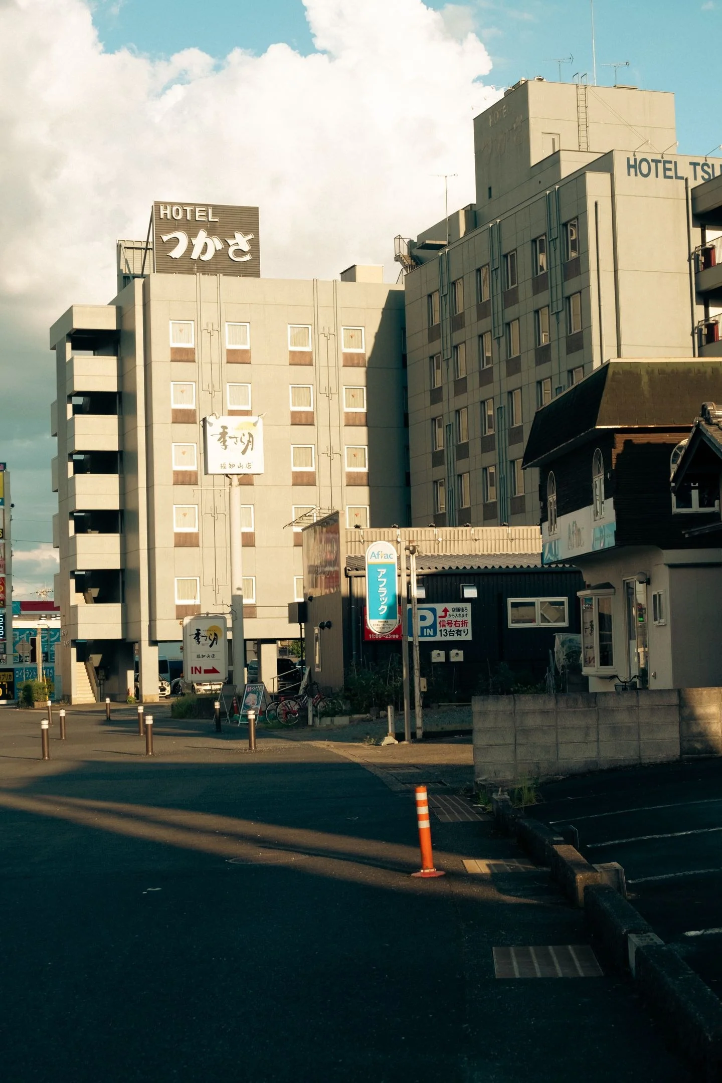 Cityscape of Fukuchiyama, Kyoto, Japan featuring hotels and streets on a sunny day.